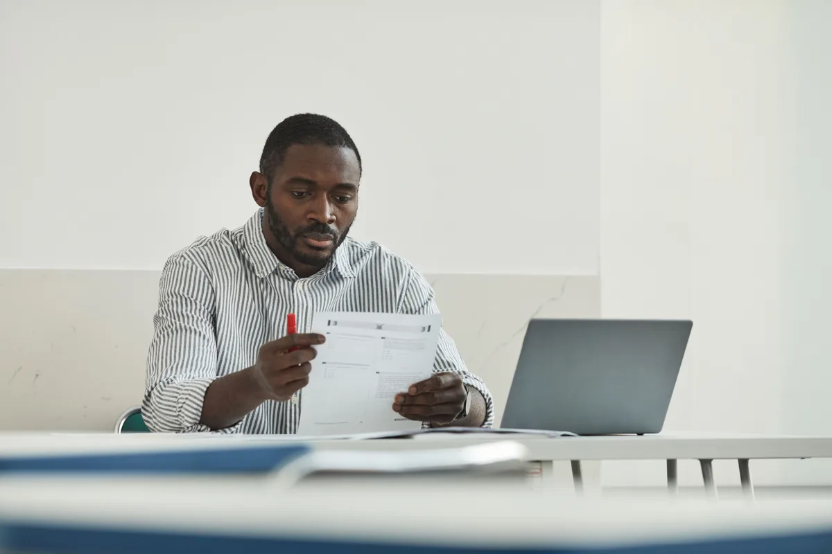 Researcher reviewing a manuscript