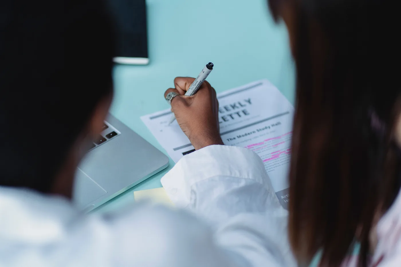 Researchers collaborating on manuscript review